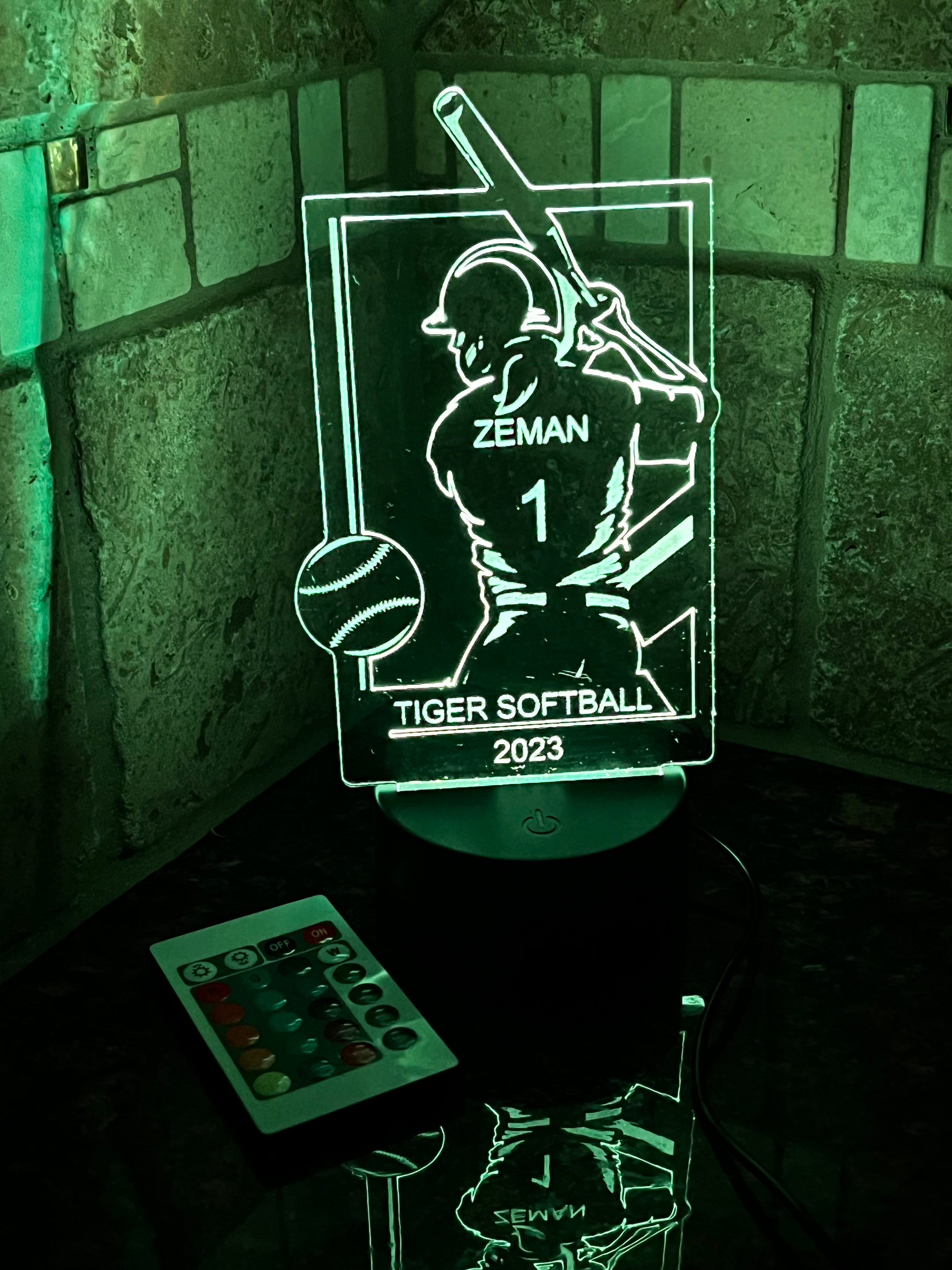 Acrylic Light Up Sign of Softball Player on an LED base.